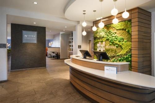 a lobby of a hotel with a green wall at EVEN Hotels Denver Tech Center-Englewood by IHG in Centennial