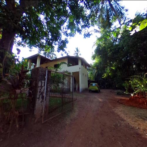 a house with a gate in front of it at Homestay, Villa in Diveagar in Diveagar