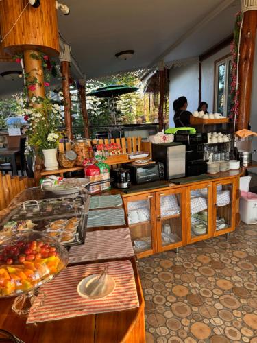 a kitchen with a counter with food on it at One khaokho homestay in Khao Kho