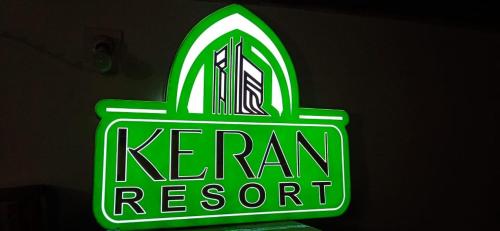 a neon sign for a kenyan restaurant at Keran resort in Keran