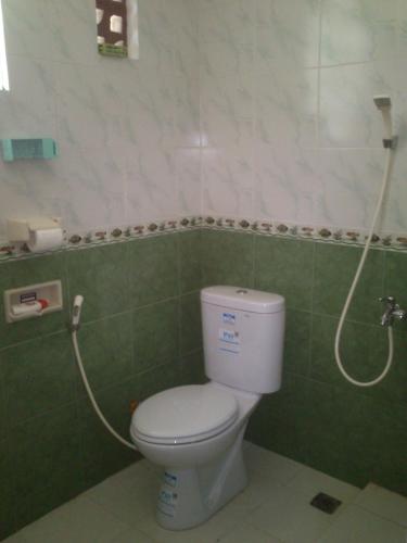 Een badkamer bij Griya Harja Homestay