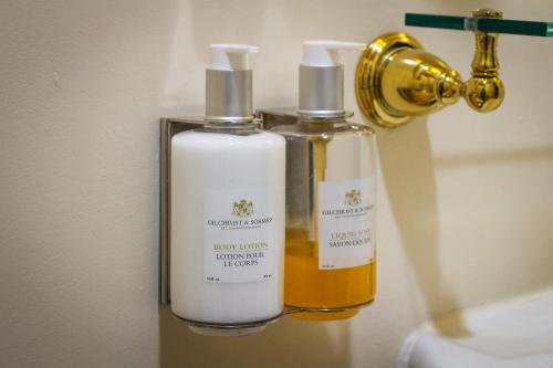 two bottles of essential oils sitting on a shelf at Hotel Majestic in San Francisco