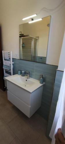 a bathroom with a sink and a mirror at nonna flo in Monterosso al Mare