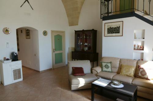 a living room with a couch and a table at Donna Lina in Matera