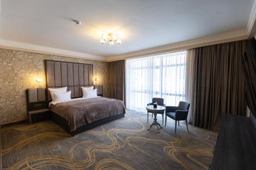 Ліжко або ліжка в номері Multi Grand Resort