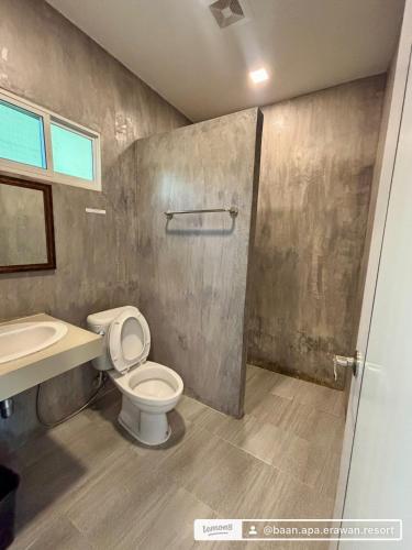 a bathroom with a toilet and a sink at BAAN APA ERAWAN Resort in Ban Pong Pat