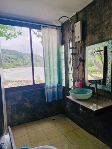 a bathroom with a glass sink and a window at Family view A3 -Kantiang paradise resort- in Ko Lanta