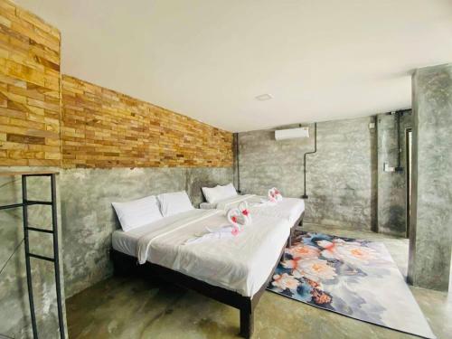 a bedroom with a bed with pink flamingos on it at Family view A3 -Kantiang paradise resort- in Ko Lanta
