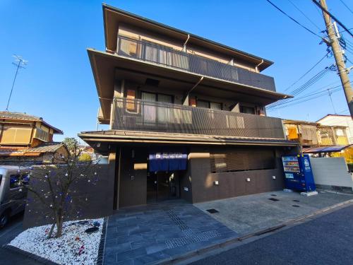 a building on the side of a street at Rest Collection Jingu Nijo Kyoto in Kyoto