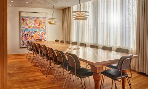 a conference room with a long table and chairs at Reykjavik Natura - Berjaya Iceland Hotels in Reykjavík