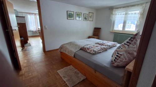 a bedroom with a bed in a room at Ferienhof Ziegler- Sonnenschein in Baiersbronn