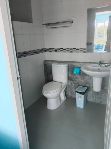 a bathroom with a toilet and a sink at Bedroom401 Kata Beach Phuket in Kata Beach