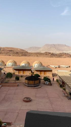 a large building in the middle of the desert at Golden Camp- wadi rum in Wadi Rum