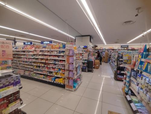 a store aisle of a grocery store with products at Sengakuji 602, 40 square meters house Direct train from the airport in Tokyo