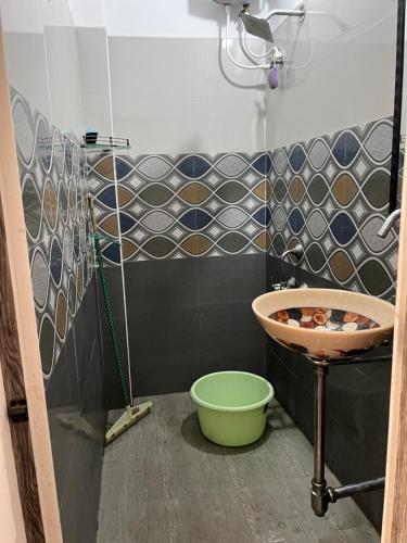 a bathroom with a sink and a bowl in it at THEE Confort rooms in Pondicherry