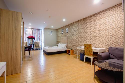 a living room with a couch and a table at Bangi Perdana Hotel in Bangi