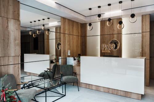 a lobby with a reception desk and chairs at Комплекс РАЙ in Ognyanovo