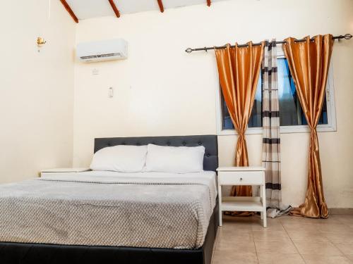 Llit o llits en una habitació de Bougan Villa