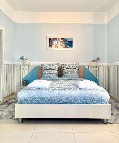 a bedroom with a large bed in a room at Vila Palas in Vrnjačka Banja