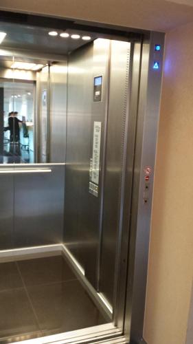 a stainless steel elevator in a building at Hotel Zena Beauty & Shopping Center in Hévíz