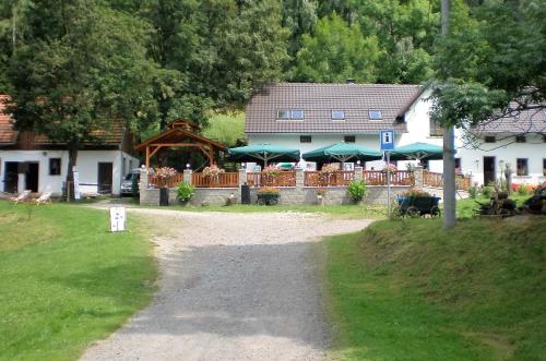a path in front of a house with a building at Green Valley Park in Stárkov