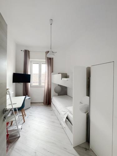 a bedroom with a bed and a desk and a mirror at B&B da Matteo in Telese