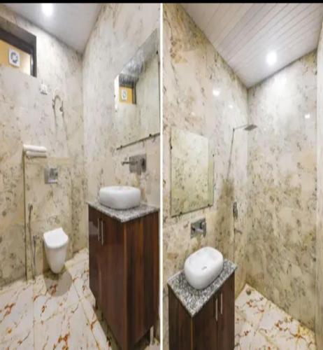 a bathroom with a toilet and a sink and a shower at Hotel Villa Getaway in New Delhi