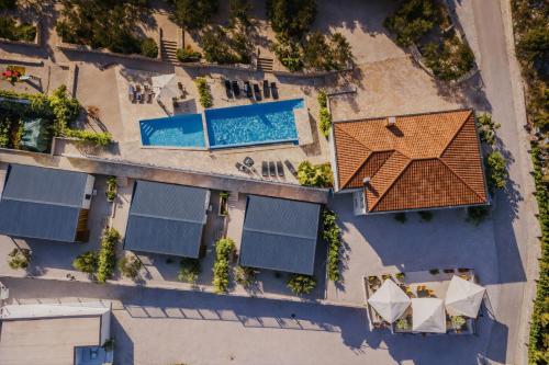 an overhead view of a house with a pool at Panorama Mobilehome Vista Kornati with Pool in Drage