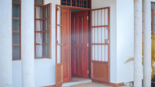 a pair of doors on a white building at Arusha 2bedroom in Arusha