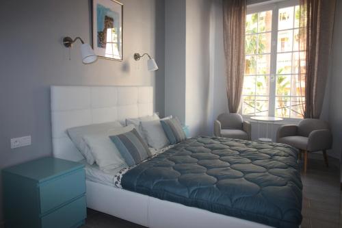 Postel nebo postele na pokoji v ubytování Apartments Monaco