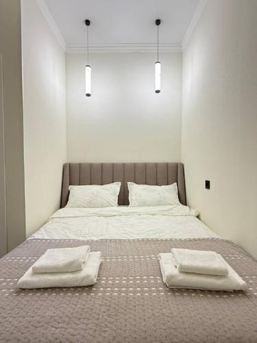 Llit o llits en una habitació de Calm Cotton