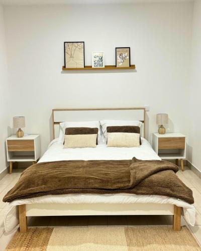 a bedroom with a large bed with two night stands at Casa do Pastor - Vale de Alfaia in Sobral do Campo