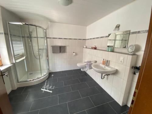 a bathroom with a sink and a shower at Ferienwohnung Moselnest in Piesport