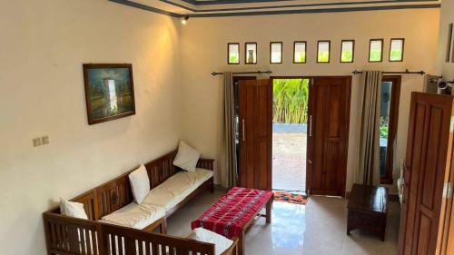 a living room with a couch and a table at Chik Nories in Labuan Bajo