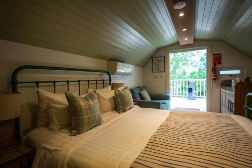 a bedroom with a large bed in a room at Tewinbury Farm Hotel in Tewin