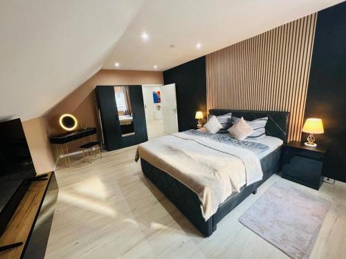 a bedroom with a large bed and a piano at Spacious home in quiet surroundings in Schwanden