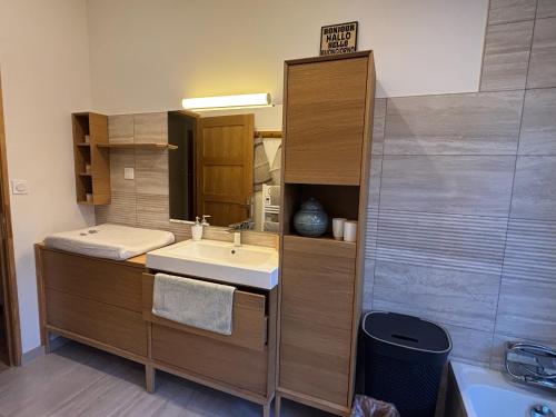 a bathroom with a sink and a mirror at Domaine Hestia in Robion en Luberon