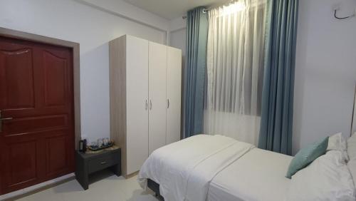 Krevet ili kreveti u jedinici u okviru objekta Rose Homestay