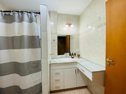 a bathroom with a sink and a shower at Las Agujas in Aldea Camarero