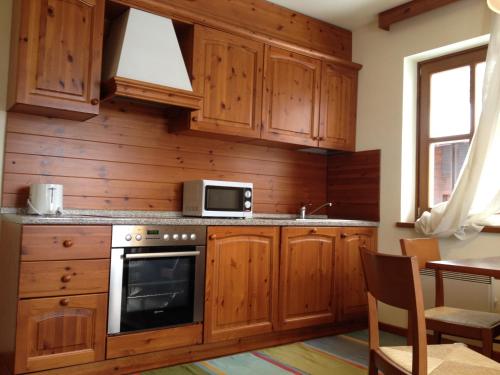 Kuchyň nebo kuchyňský kout v ubytování Appartement Colussi