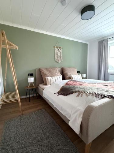 a bedroom with a large bed in a room at Apartment 18 in Kurort Oberwiesenthal