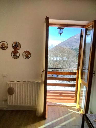 a door leading to a balcony with a view at A casa di Giulia in Filettino