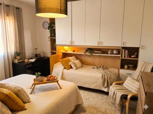 a living room with two beds and a couch at B&b GIOIA in Massa Lombarda