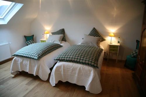 Postel nebo postele na pokoji v ubytování Les Chambres du Beau Regard