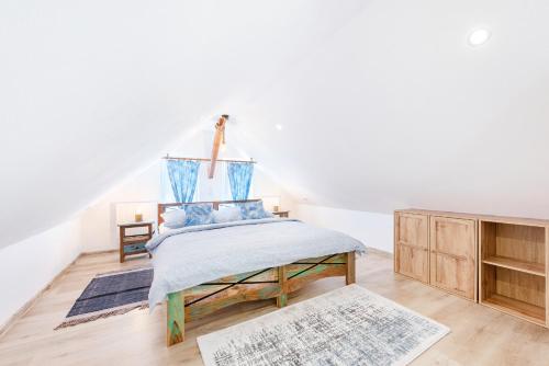 a bedroom with a bed and a dresser at Apartmány Andrea s wellness in Zdíkov