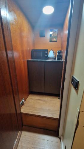 an open door to a kitchen with a counter at Cornelia Below Deck in Amsterdam