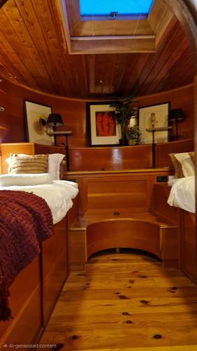 a bedroom with a bed and a desk in it at Cornelia Below Deck in Amsterdam