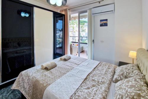 a bedroom with a bed with two teddy bears on it at Panorama Sky Apartment in Sarandë