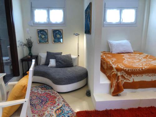 a small room with a bed and a bed sqor at Κτήμα Ανάσες Ζωής- Ευγενία Σγούρα in Epanomi