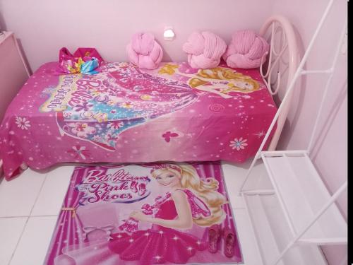 a barbie in a barbie room with a bed at Casa Rosa in Frederico Westphalen